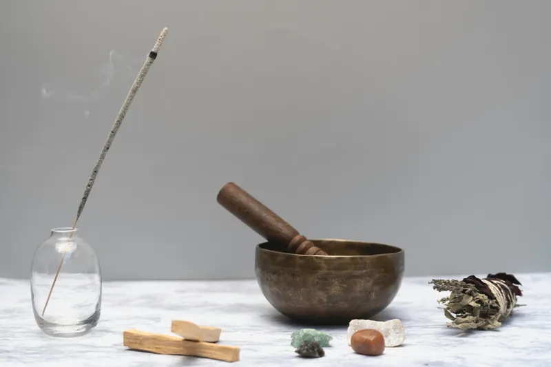 Crystal cleansing supplies - sage, palo santo, singing bowl, incense